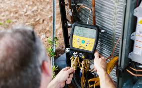 tech repairing hvac system